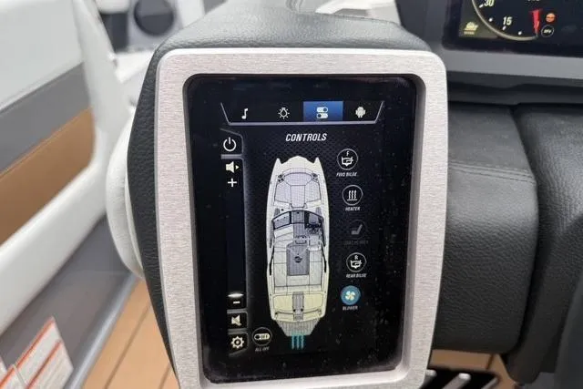 Slide: The Image of Touchscreen control panel in a 2022 Malibu Wakesetter 23 MXZ boat cockpit. - 26