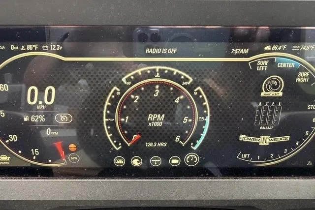 Slide: The Image of Dashboard of 2022 Malibu Wakesetter 23 MXZ showing RPM, speed, and surf settings. - 25