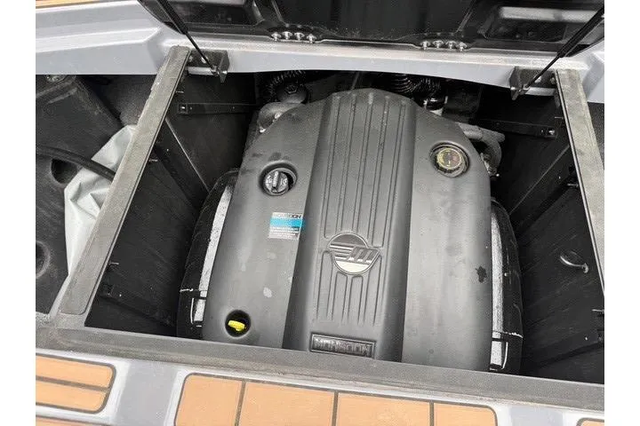 Slide: The Image of 2022 Malibu Wakesetter 23 MXZ engine compartment, showcasing powerful marine engine design. - 33