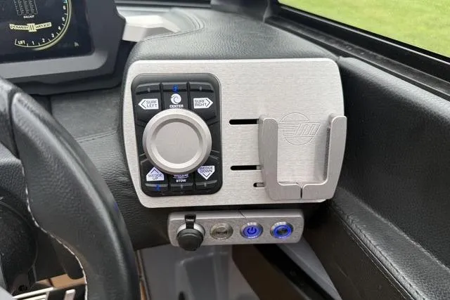 Slide: The Image of Control panel of 2022 Malibu Wakesetter 23 MXZ boat, featuring navigation and function buttons. - 27
