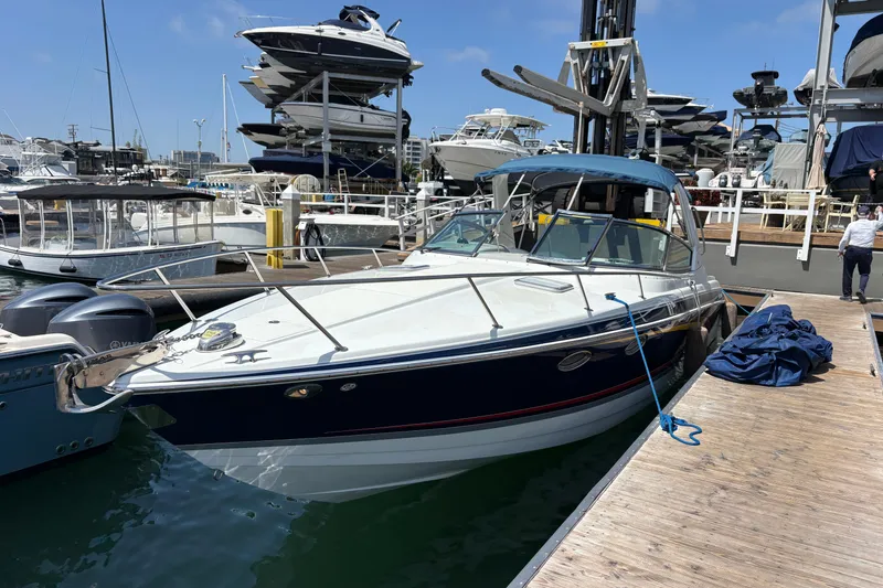 Slide: The Image of 2007 Formula 330 Sun Sport boat docked at marina with stacked yachts in background. - 4
