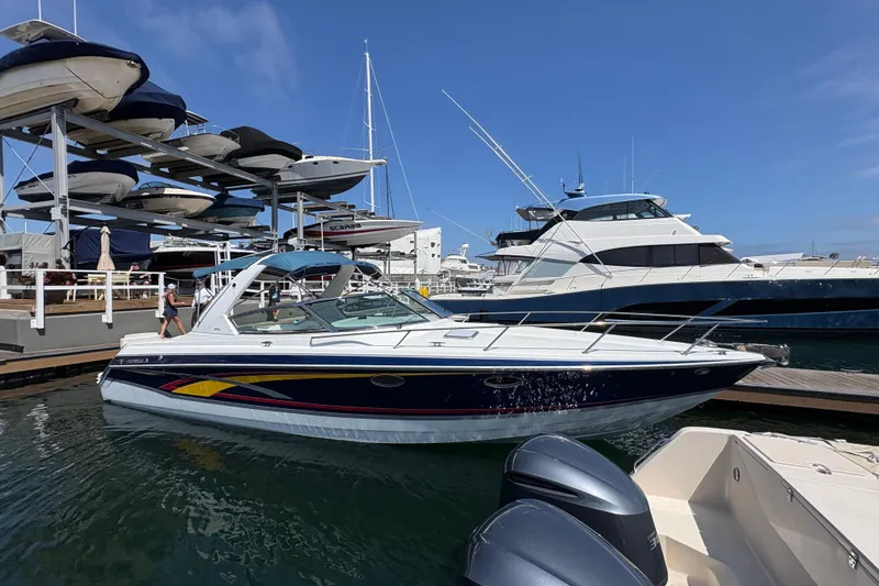 Slide: The Image of 2007 Formula 330 Sun Sport boat docked at a marina with other yachts. - 1