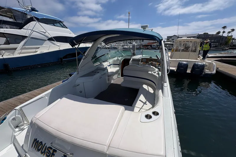 Slide: The Image of 2007 Formula 330 Sun Sport boat docked at marina under clear sky. - 9