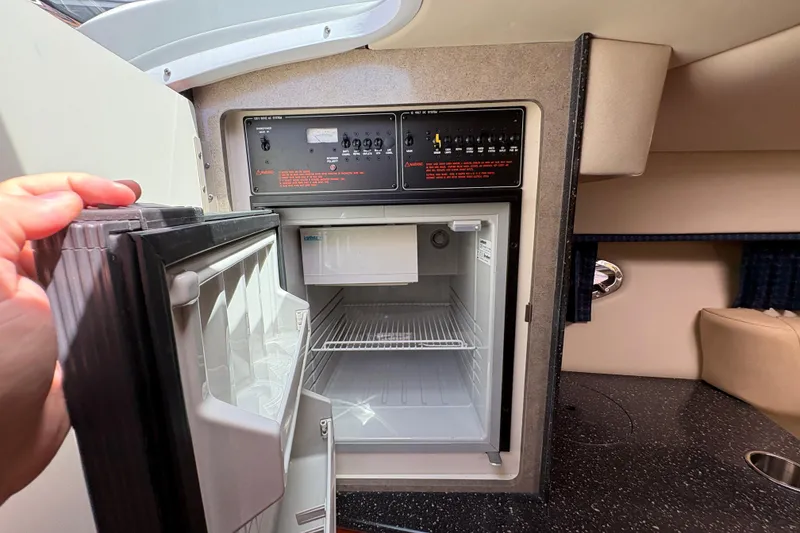 Slide: The Image of 2007 Formula 330 Sun Sport cabin with open mini fridge and control panel. - 20