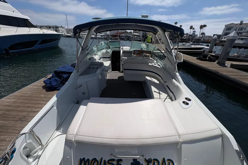 Slide: The Image of 2007 Formula 330 Sun Sport boat docked at marina, featuring spacious seating and sleek design. - 8
