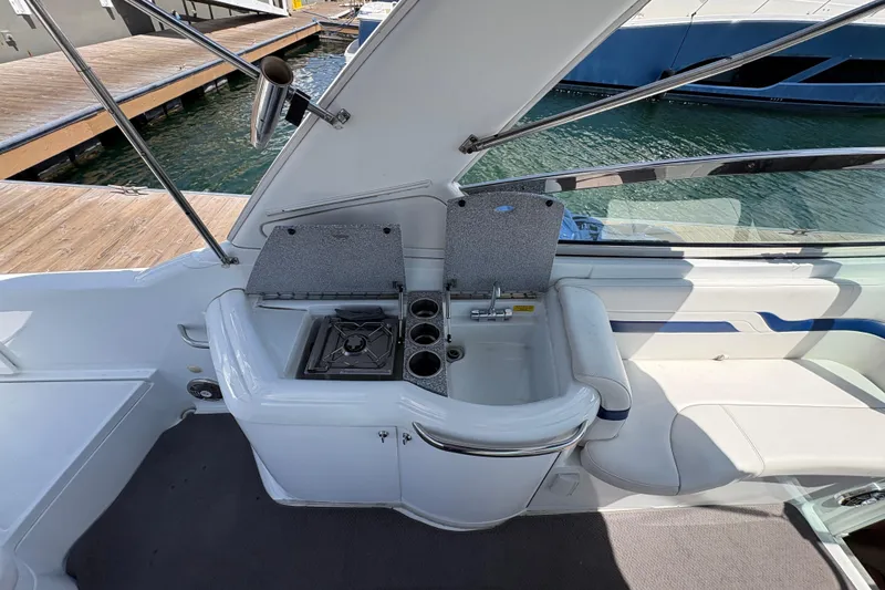 Slide: The Image of 2007 Formula 330 Sun Sport boat interior with kitchenette and seating area. - 11