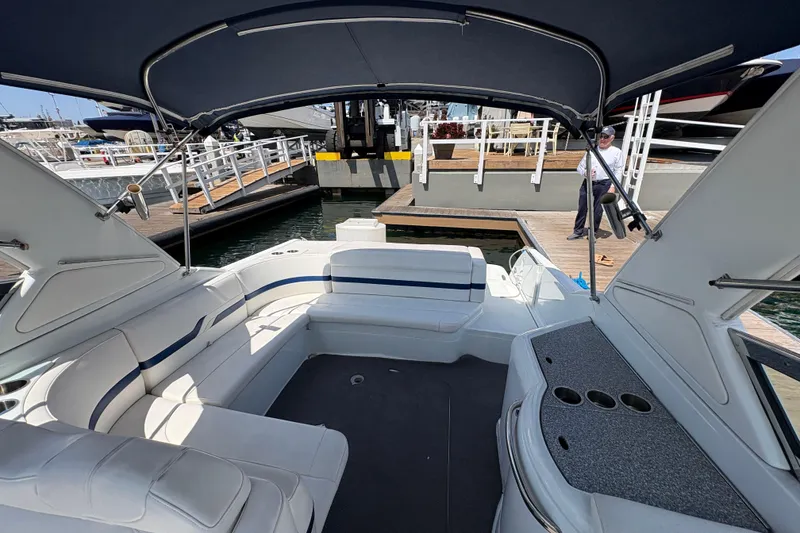 Slide: The Image of 2007 Formula 330 Sun Sport boat interior with seating and dock view. - 10