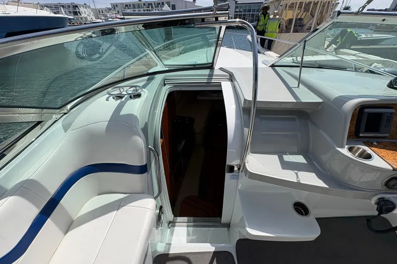 Slide: The Image of 2007 Formula 330 Sun Sport boat interior with open cabin door and seating area. - 14