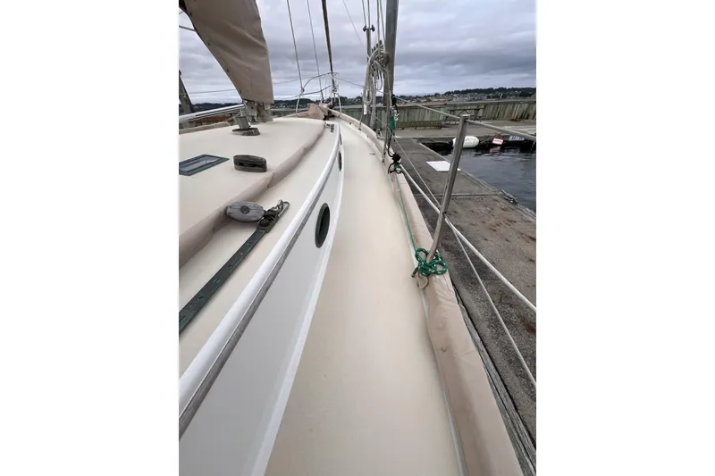 Slide: The Image of 1977 Alajuela 38 MKI sailboat deck view at marina, overcast sky. - 19
