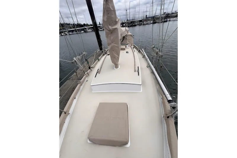 Slide: The Image of 1977 Alajuela 38 MKI sailboat deck view at marina, overcast sky. - 20