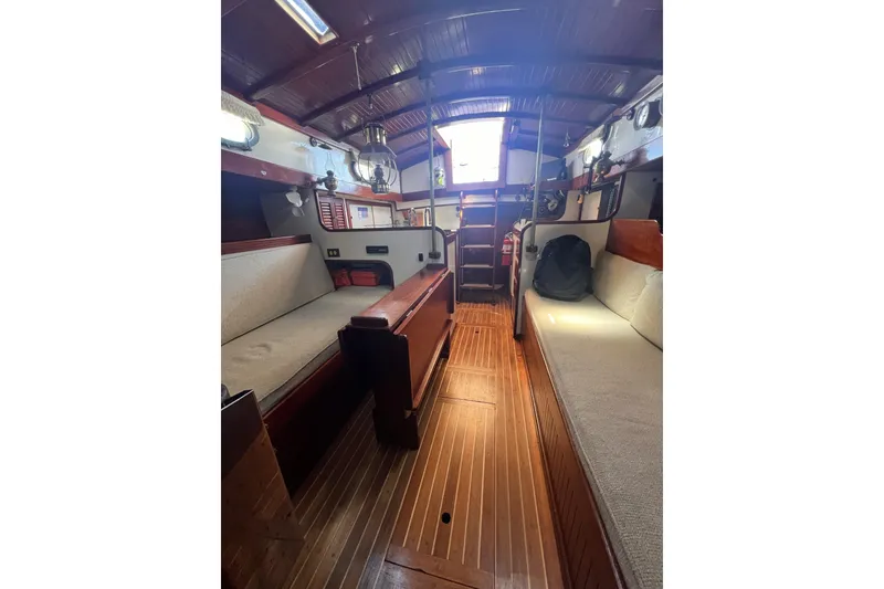 Slide: The Image of Interior of 1977 Alajuela 38 MKI sailboat with wooden finishes and cozy seating. - 43