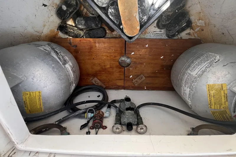 Slide: The Image of Storage compartment of a 1977 Alajuela 38 MKI with propane tanks and equipment. - 65
