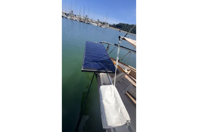 Slide: The Image of Sailboat Alajuela 38 MKI (1977) with solar panel docked in a marina. - 31