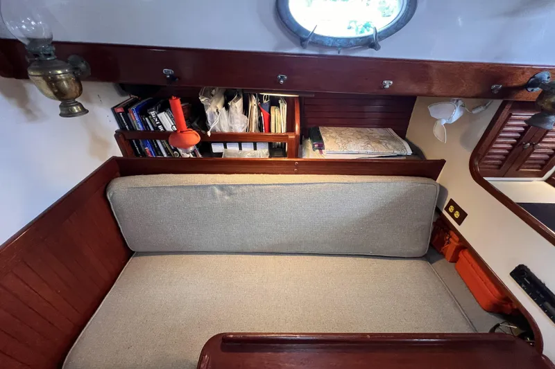 Slide: The Image of Cozy interior of 1977 Alajuela 38 MKI sailboat with books and maps. - 45