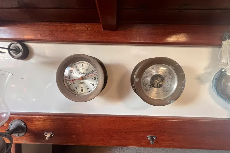 Slide: The Image of Vintage Alajuela 38 MKI 1977 yacht interior with clock and barometer on wooden panel. - 44