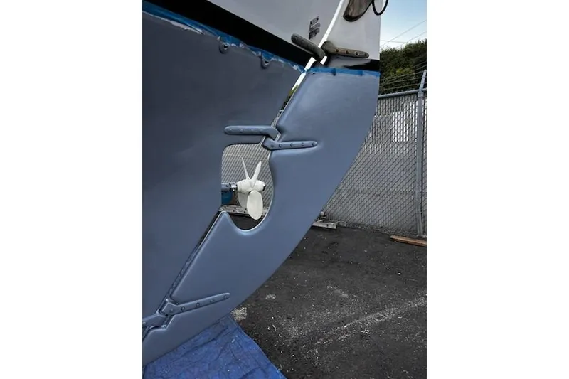 Slide: The Image of Close-up of 1977 Alajuela 38 MKI sailboat rudder and propeller in a boatyard. - 68