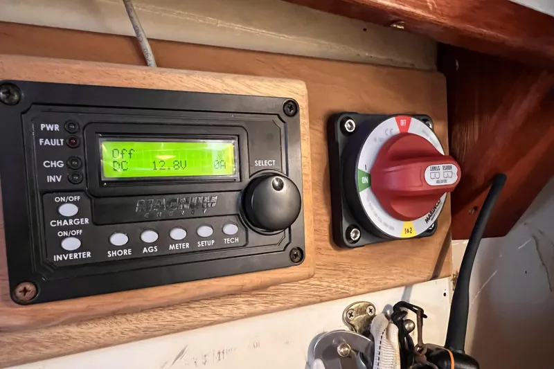 Slide: The Image of Control panel of a 1977 Alajuela 38 MKI sailboat with battery monitor and switch. - 35