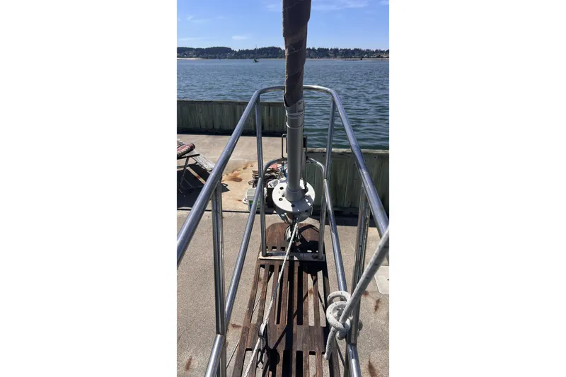 Slide: The Image of Bow of 1977 Alajuela 38 MKI sailboat docked by the water. - 55