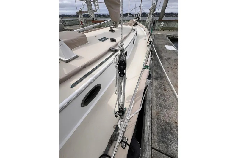 Slide: The Image of 1977 Alajuela 38 MKI sailboat docked, showcasing deck and rigging details. - 26