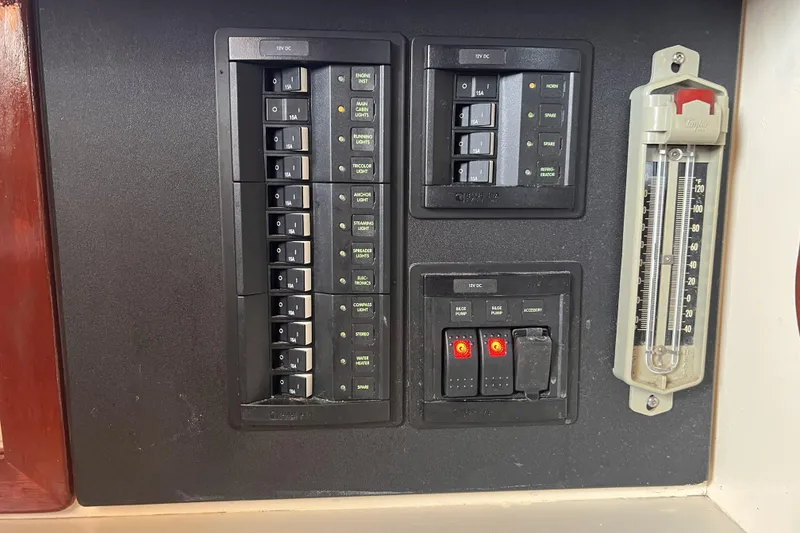 Slide: The Image of Electrical panel and thermometer on a 1977 Alajuela 38 MKI sailboat. - 58