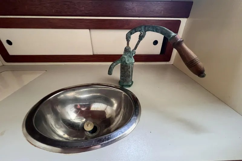 Slide: The Image of Vintage Alajuela 38 MKI 1977 boat sink with classic pump faucet. - 42