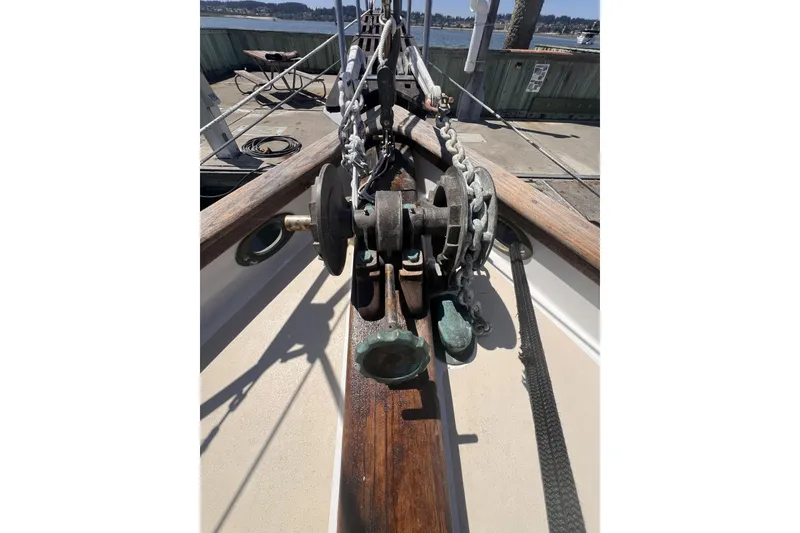 Slide: The Image of Bow of 1977 Alajuela 38 MKI sailboat with anchor chain and windlass. - 56