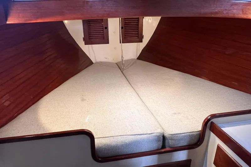 Slide: The Image of Interior cabin of 1977 Alajuela 38 MKI sailboat with wooden finish and cushioned berth. - 50