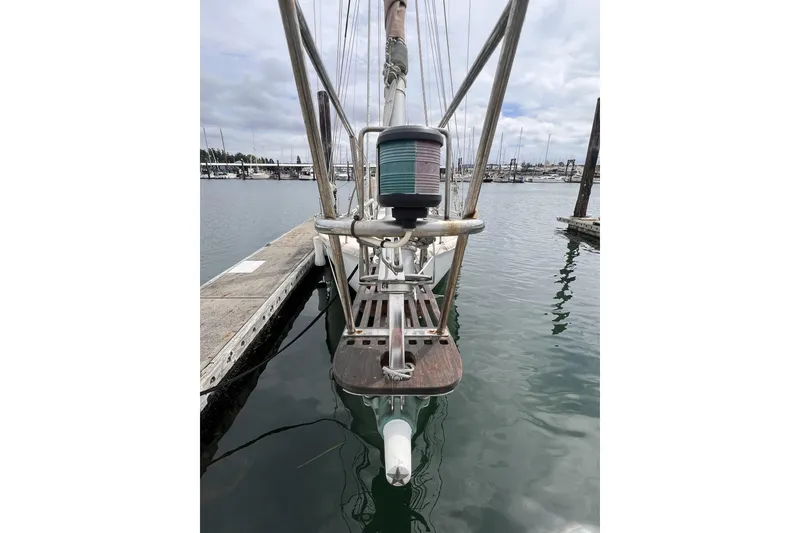 Slide: The Image of Bow view of 1977 Alajuela 38 MKI sailboat docked in a marina. - 53