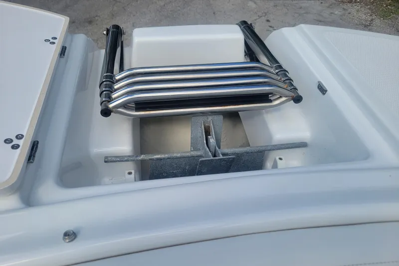 Slide: The Image of 2022 Four Winns HD3 boat anchor compartment with stainless steel ladder. - 35