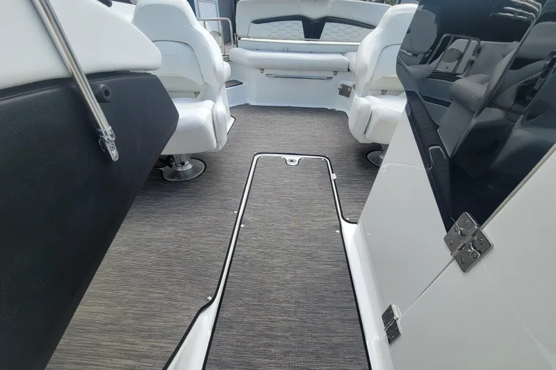 Slide: The Image of Interior of 2022 Four Winns HD3 boat with modern seating and flooring. - 26