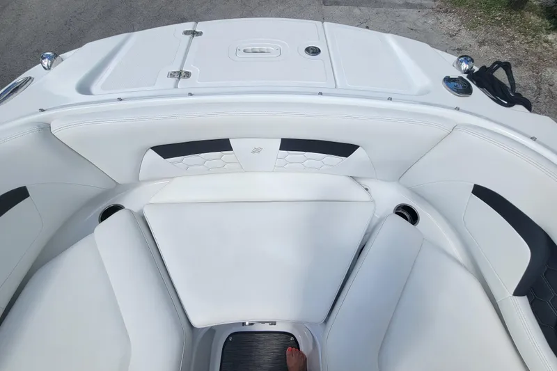 Slide: The Image of 2022 Four Winns HD3 boat interior with white seating and modern design. - 32