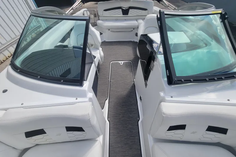 Slide: The Image of 2022 Four Winns HD3 boat interior with white seating and sleek design. - 27