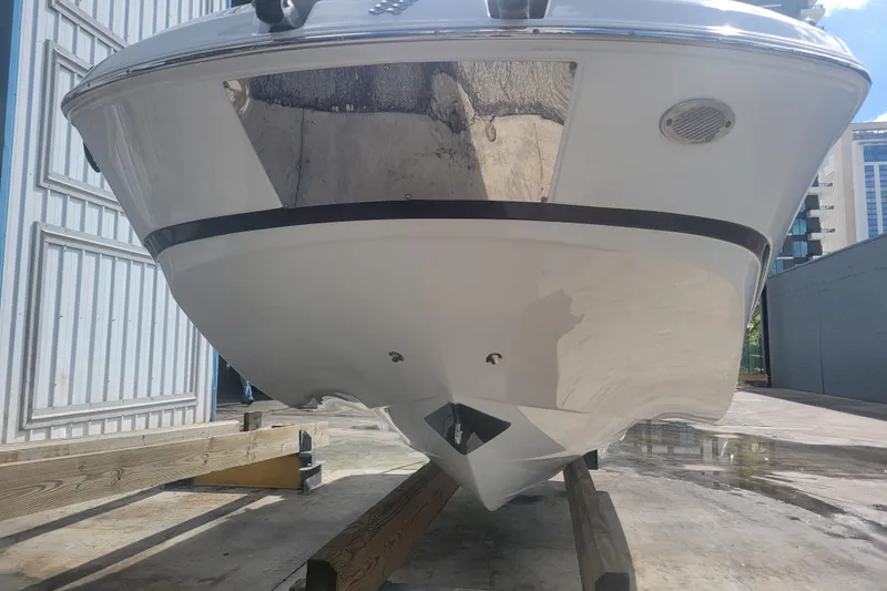 Slide: The Image of 2022 Four Winns HD3 boat on a trailer, viewed from the front. - 2