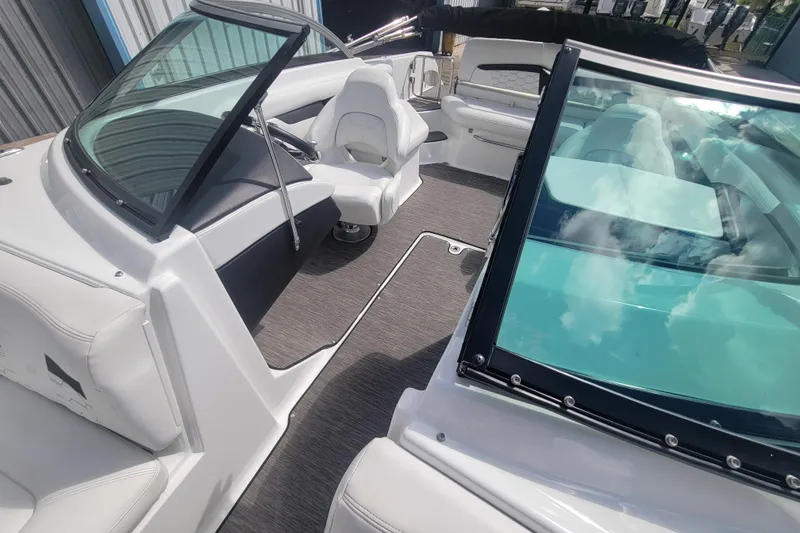 Slide: The Image of 2022 Four Winns HD3 boat interior with seating and windshield, showcasing modern design. - 28