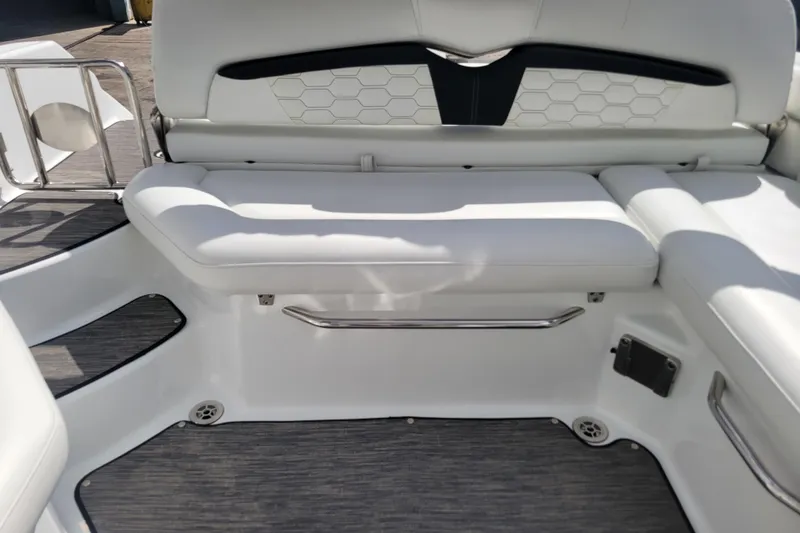 Slide: The Image of 2022 Four Winns HD3 boat interior with white cushioned seating and modern design. - 14