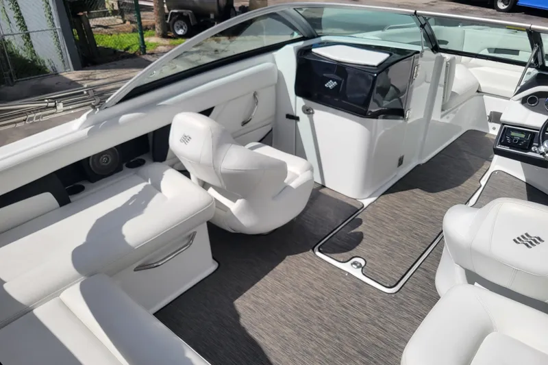 Slide: The Image of 2022 Four Winns HD3 boat interior with white seating and modern design. - 12
