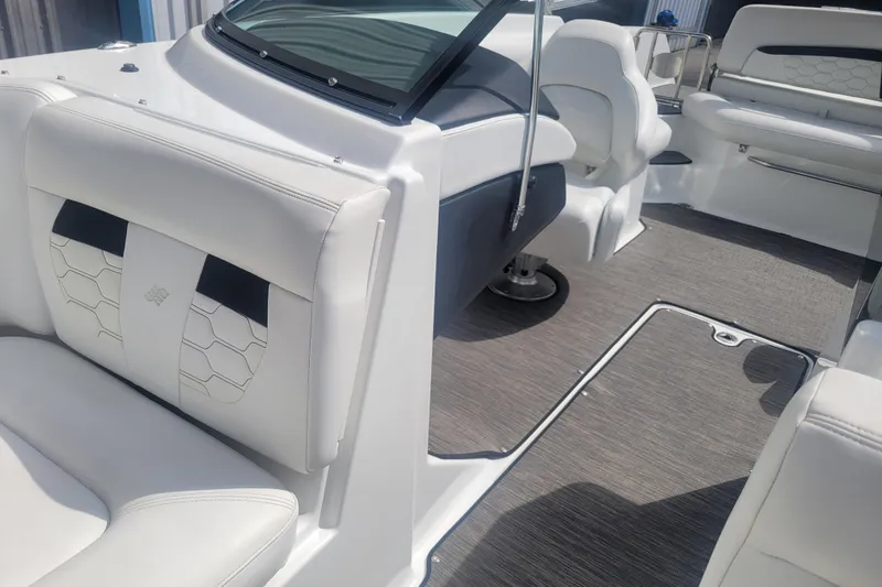 Slide: The Image of 2022 Four Winns HD3 boat interior with white seating and modern design. - 31