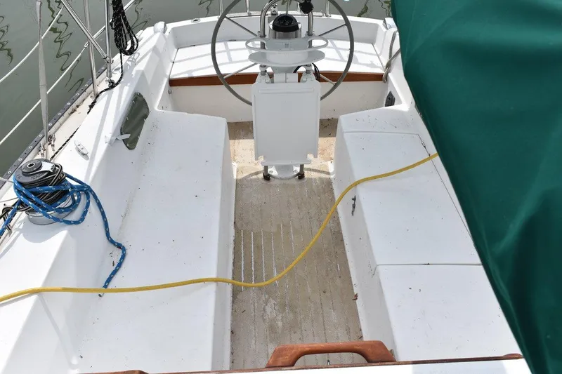 Slide: The Image of Cockpit of 1984 Catalina 36 MkII sailboat with steering wheel and seating. - 17