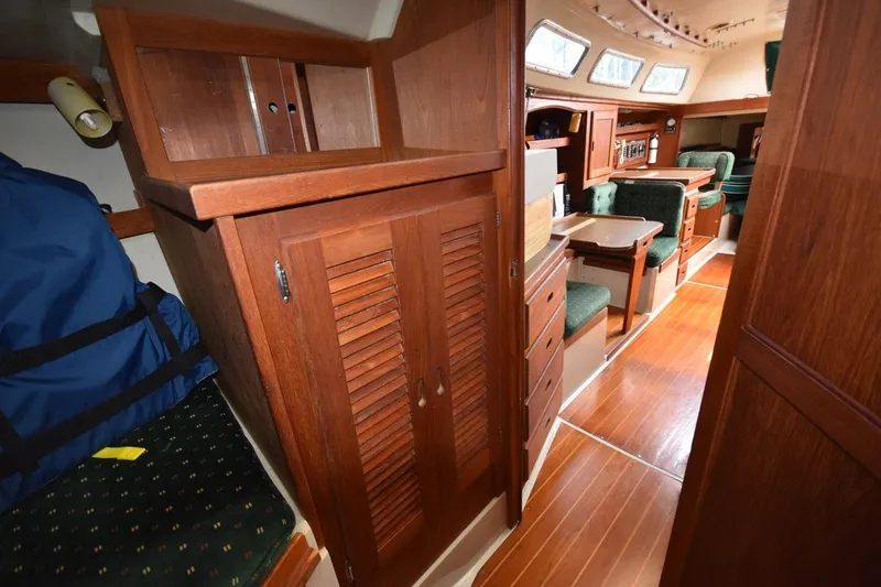 Slide: The Image of Interior of 1984 Catalina 36 MkII sailboat with wooden cabinetry and seating area. - 32
