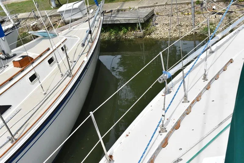 Slide: The Image of Two Catalina 36 MkII sailboats docked side by side in a marina, 1984 model. - 13