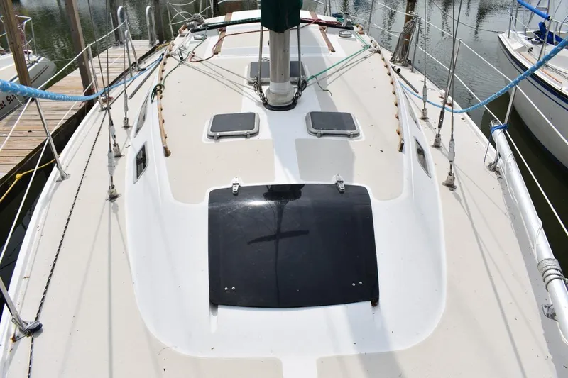 Slide: The Image of 1984 Catalina 36 MkII sailboat deck view with hatches and rigging. - 11