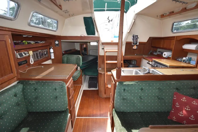 Slide: The Image of Interior of 1984 Catalina 36 MkII sailboat with wood finish and green upholstery. - 34