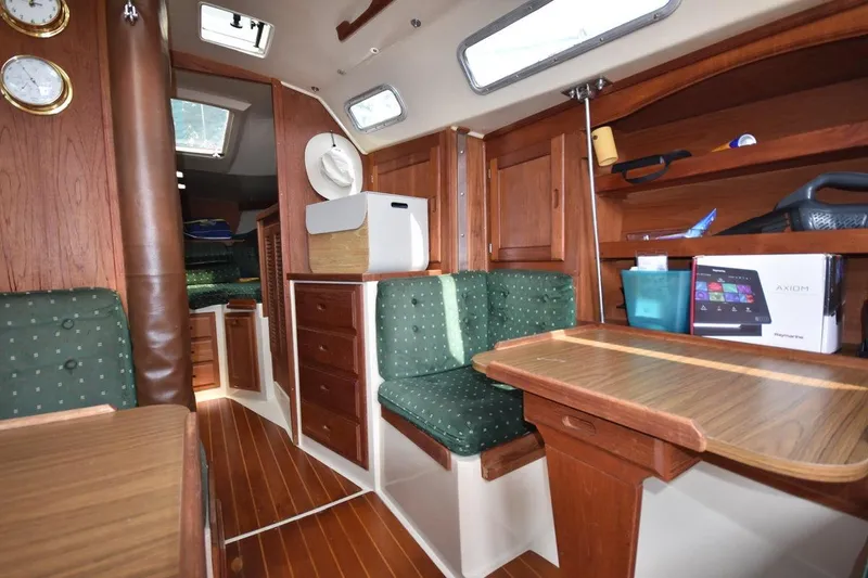 Slide: The Image of Interior of 1984 Catalina 36 MkII sailboat with wood finish and green upholstery. - 28