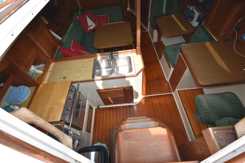 Slide: The Image of Interior of 1984 Catalina 36 MkII sailboat with wood finish and compact kitchen. - 22