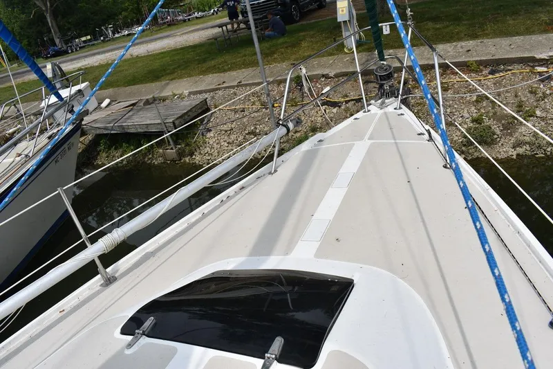 Slide: The Image of Bow view of 1984 Catalina 36 MkII sailboat docked, featuring deck and rigging. - 9