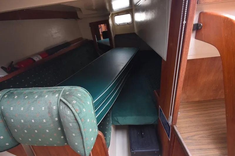 Slide: The Image of Interior cabin of 1984 Catalina 36 MkII sailboat with green upholstery and wooden accents. - 35