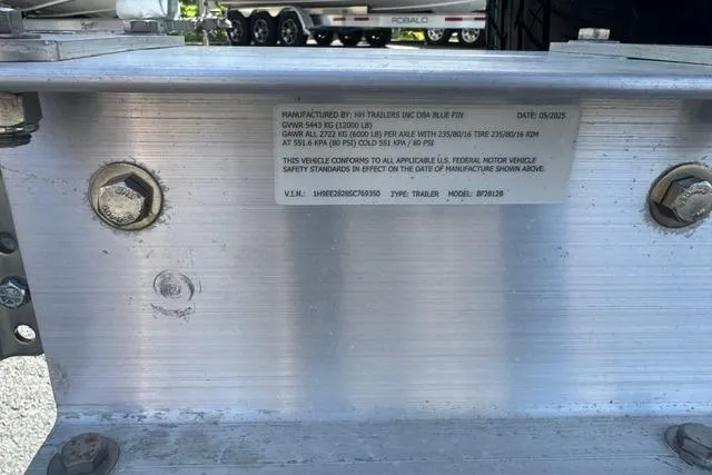 Slide: The Image of Close-up of a trailer's VIN plate with manufacturing details and specifications. - 22