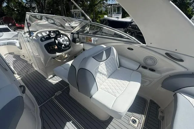 Slide: The Image of 2004 Monterey 298SS Super Sport boat interior with steering console and cushioned seating. - 12