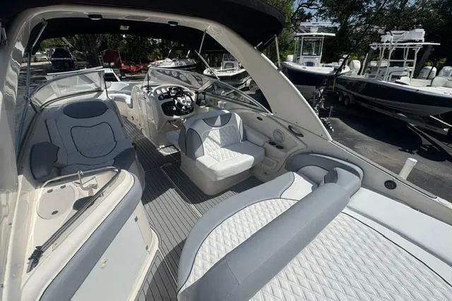 Slide: The Image of Interior view of a 2004 Monterey 298SS Super Sport boat with luxurious seating and helm. - 11
