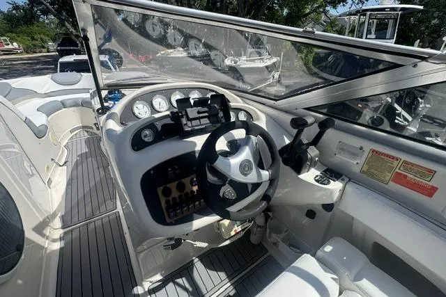 Slide: The Image of Cockpit of 2004 Monterey 298SS Super Sport boat with steering wheel and control panel. - 15